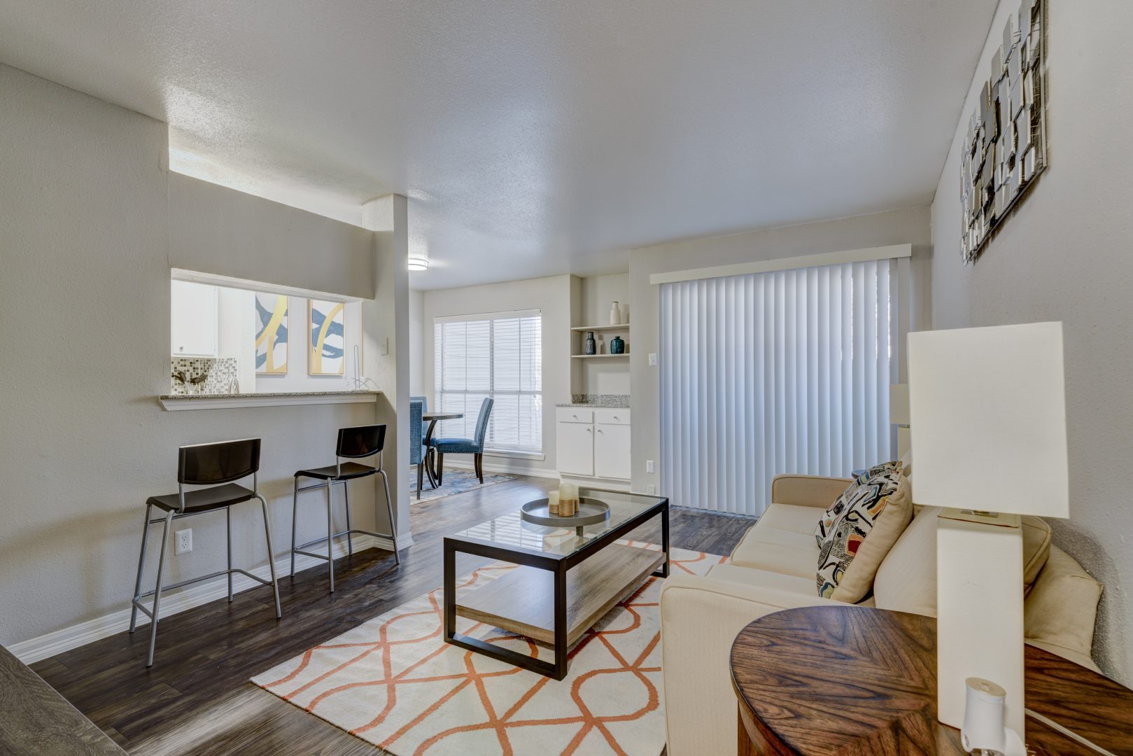the living room and kitchen area of a apartment at The Caldera Apartments