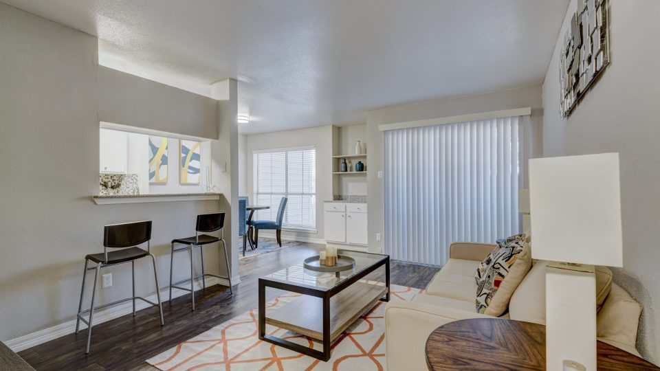 the living room and kitchen area of a apartment at The Caldera Apartments