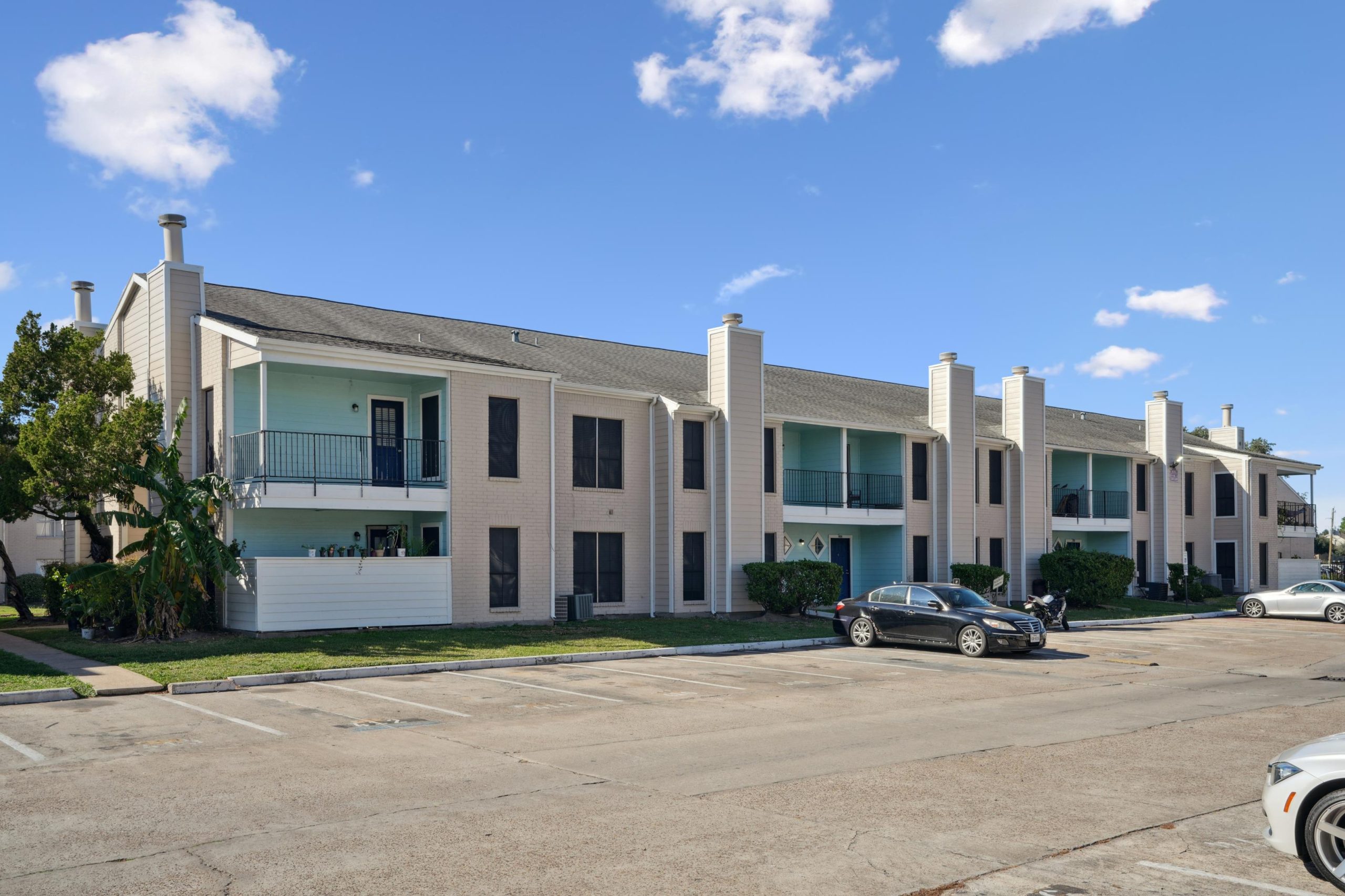 a white car parked in front of a building