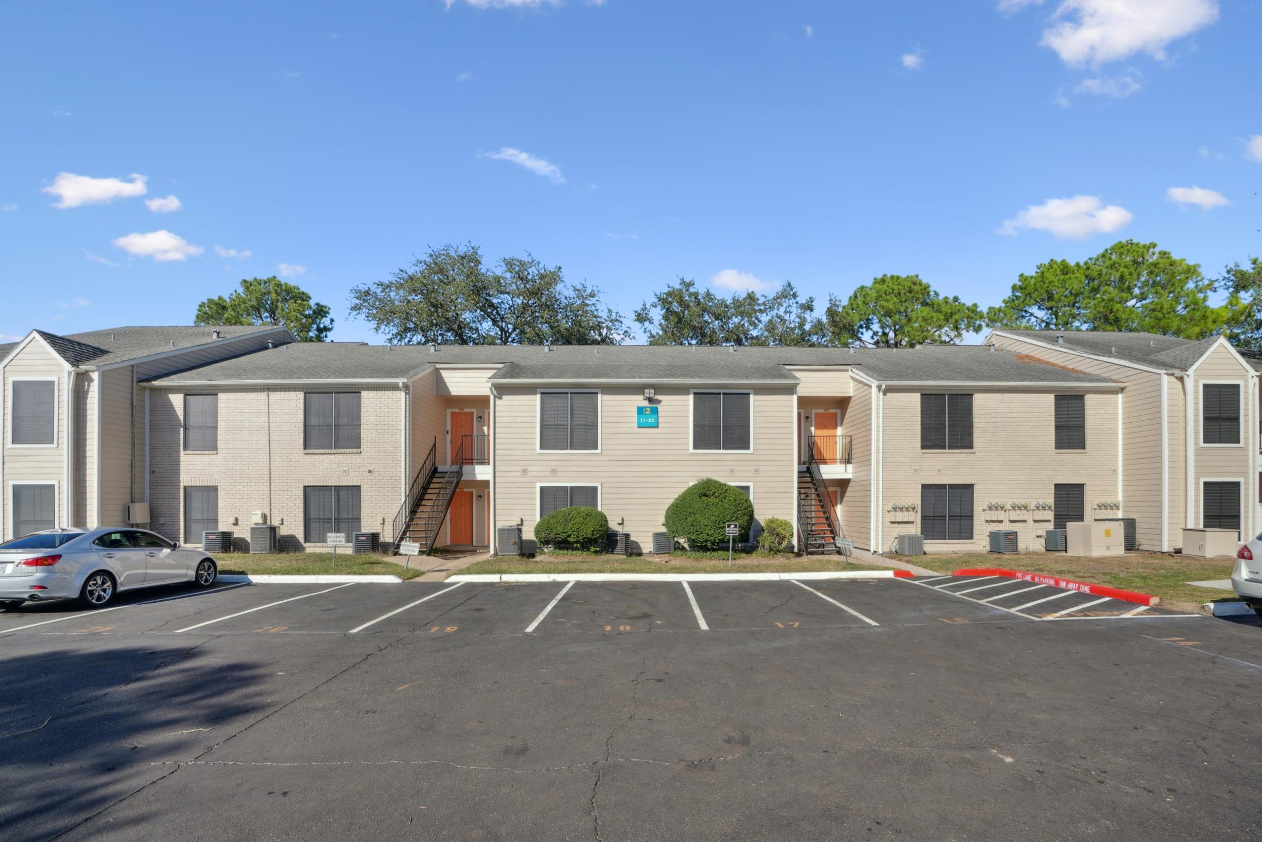 a large building with a parking meter on the side of the street