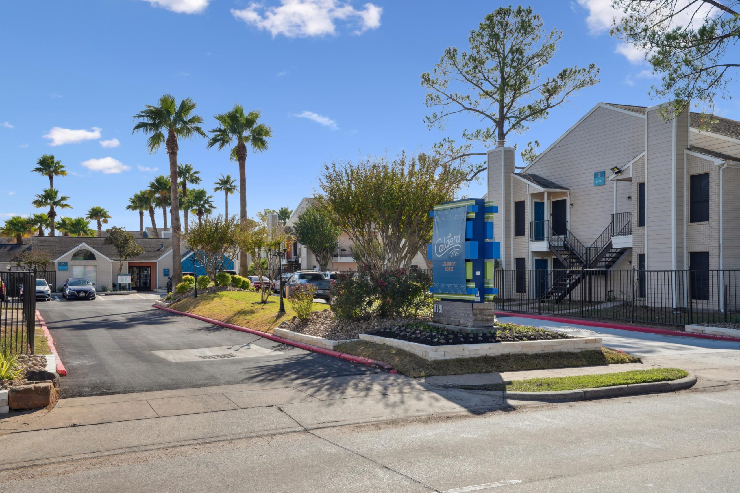 a street scene with a house and a car