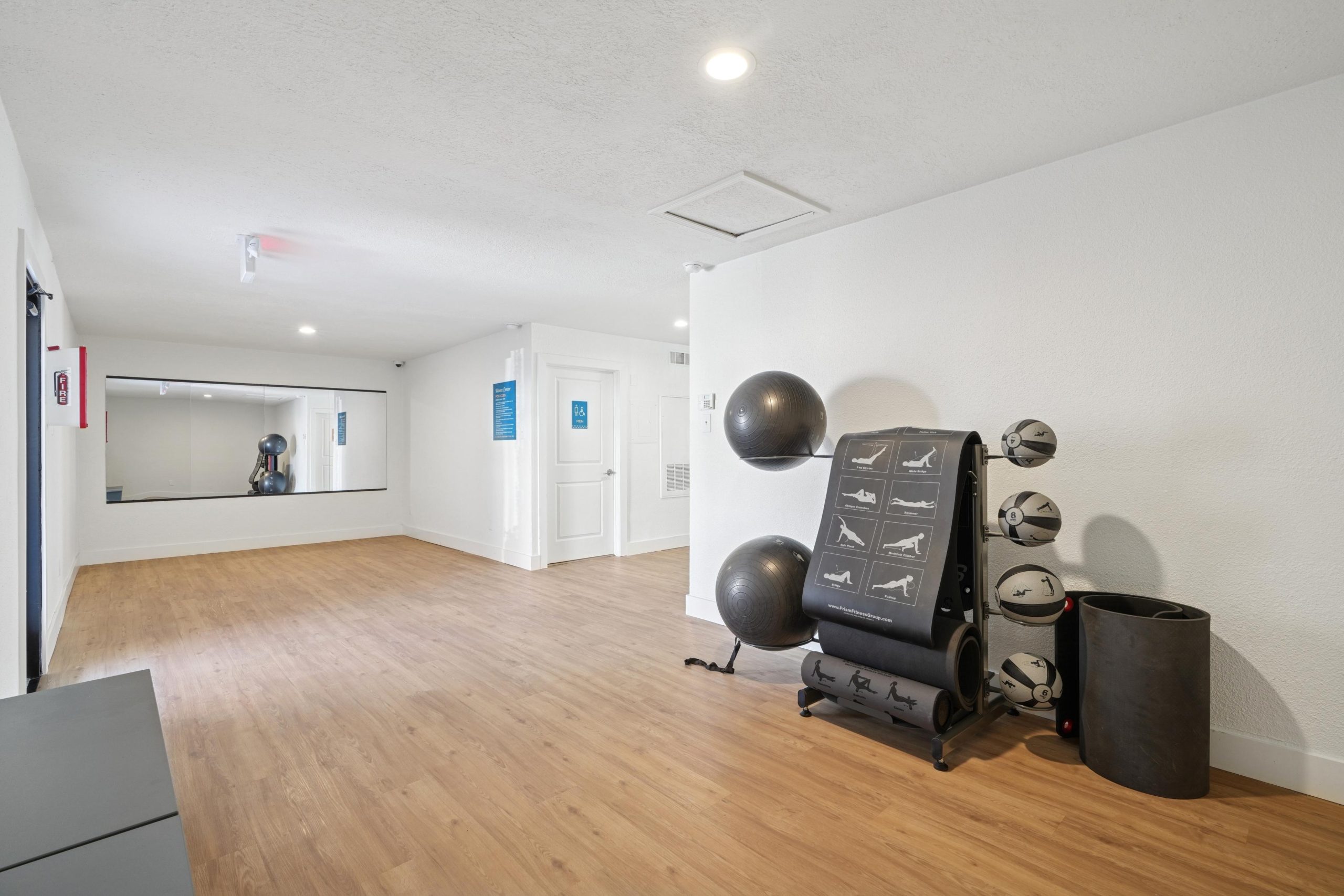 a room with a desk and a chair in it